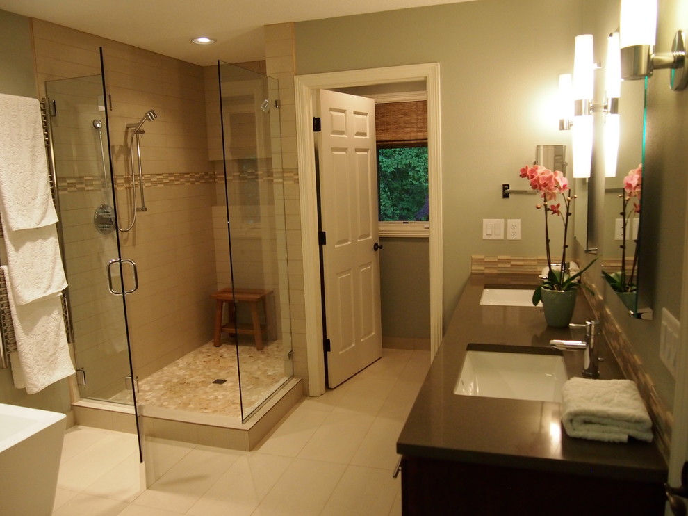 Mid-sized contemporary master bathroom in Portland with dark wood cabinets, a freestanding tub, a corner shower, beige tile and green walls.
