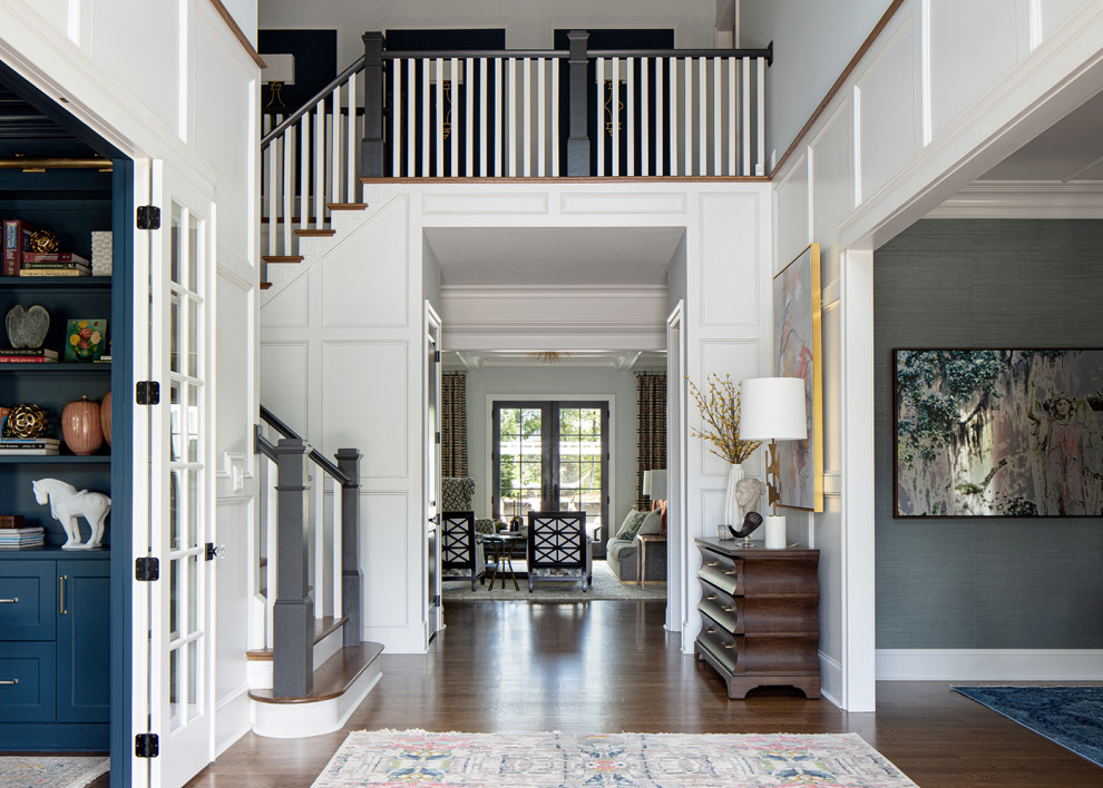 Photo of a large traditional foyer in Richmond with medium hardwood floors, a double front door, a metal front door, brown floor and decorative wall panelling.