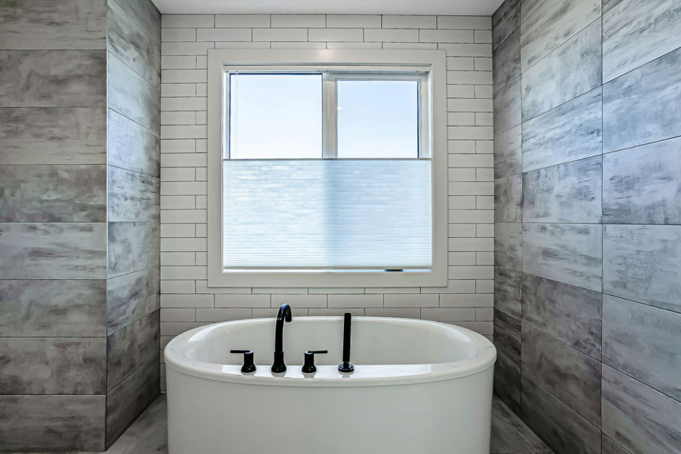 Freestanding bathtub - transitional master white tile and ceramic tile ceramic tile, multicolored floor and double-sink freestanding bathtub idea in Calgary with shaker cabinets, white cabinets, a two-piece toilet, gray walls, a vessel sink, quartz countertops, a hinged shower door, white countertops and a built-in vanity