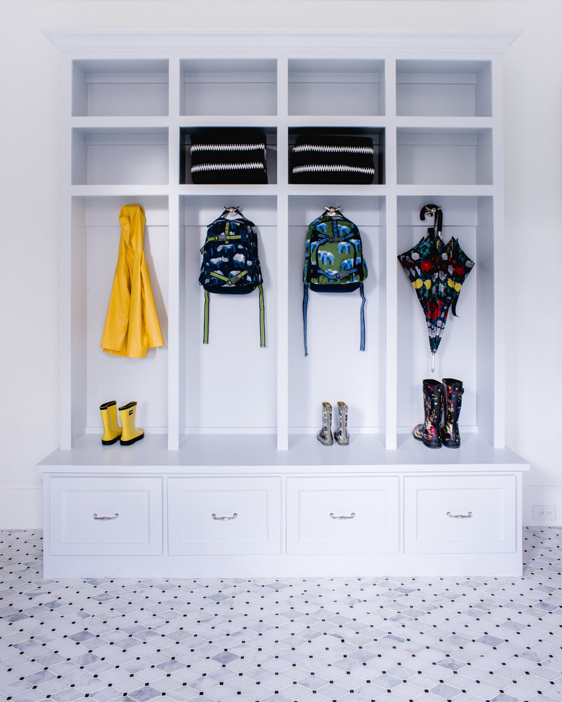 This is an example of a traditional mudroom in Dallas with white walls.