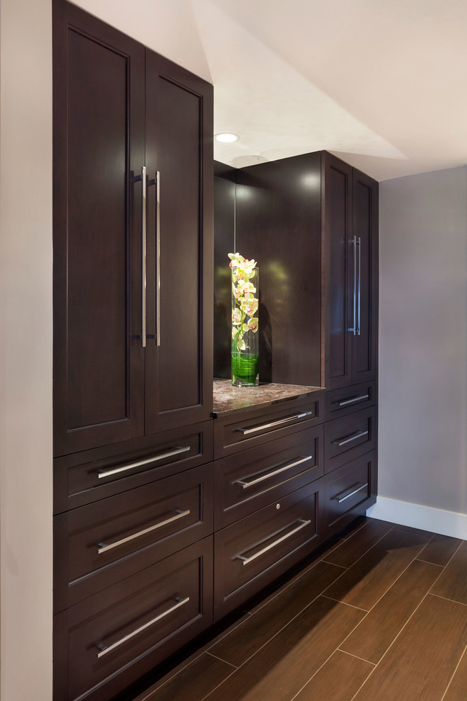 Inspiration for a large transitional medium tone wood floor and brown floor bathroom remodel in Miami with recessed-panel cabinets, dark wood cabinets, gray walls and multicolored countertops