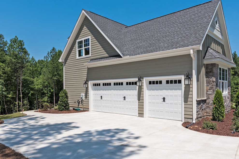 Design ideas for a large arts and crafts garage in Charlotte.