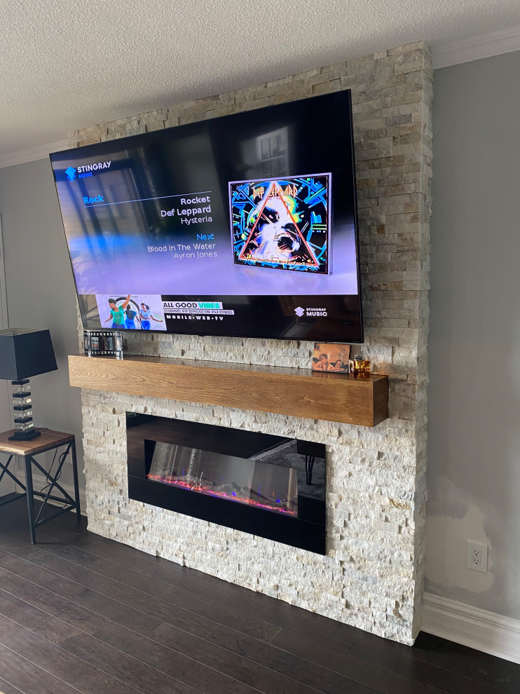 Stone Fireplace w/ Wooden Mantle & Mounted TV