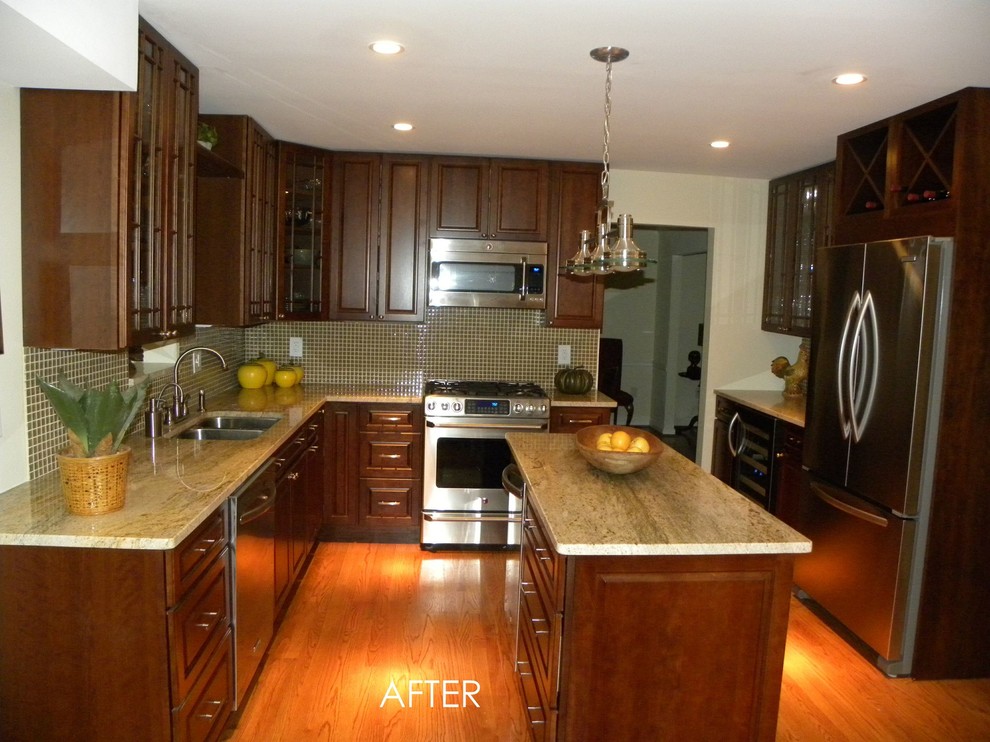 Eat-in kitchen - mid-sized transitional l-shaped medium tone wood floor eat-in kitchen idea in DC Metro with a drop-in sink, raised-panel cabinets, dark wood cabinets, granite countertops, green backsplash, glass sheet backsplash, stainless steel appliances and an island
