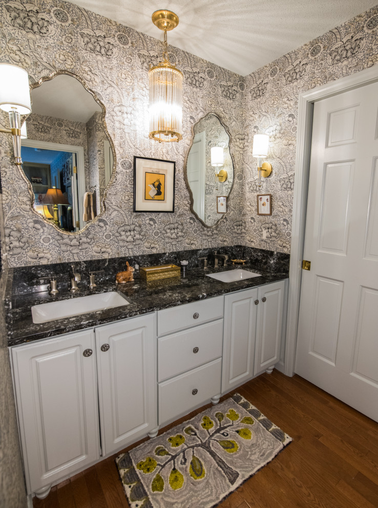 Photo of a small eclectic master bathroom in Bridgeport with white cabinets, an open shower, a two-piece toilet, white tile, ceramic tile, porcelain floors, an undermount sink, soapstone benchtops, an open shower, black benchtops, a niche, a double vanity, a built-in vanity and wallpaper.