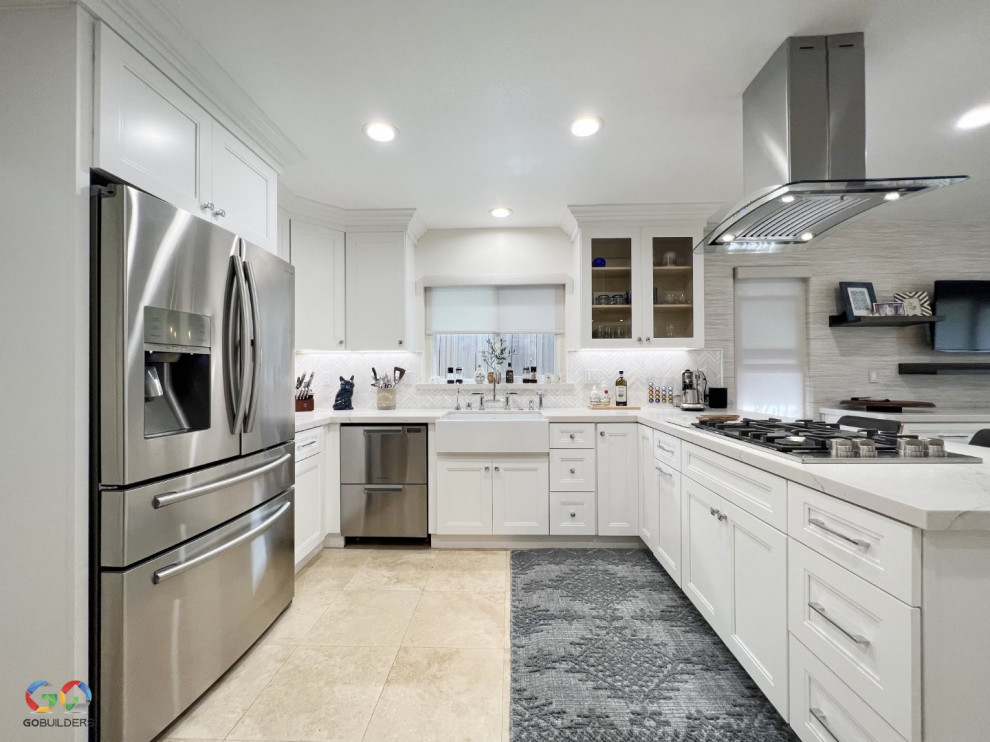 Inspiration for an expansive modern l-shaped eat-in kitchen in Orange County with a farmhouse sink, glass-front cabinets, white cabinets, quartzite benchtops, multi-coloured splashback, ceramic splashback, stainless steel appliances, ceramic floors, a peninsula, multi-coloured floor and white benchtop.