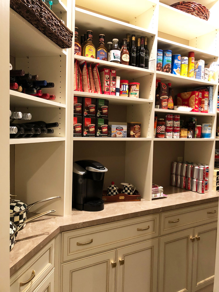 Inspiration for a small traditional kitchen pantry in New York with recessed-panel cabinets, white cabinets, laminate benchtops, ceramic floors, beige floor and beige benchtop.