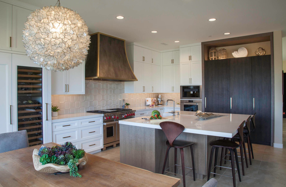 Large transitional l-shaped open concept kitchen photo in Denver with shaker cabinets, white cabinets and an island