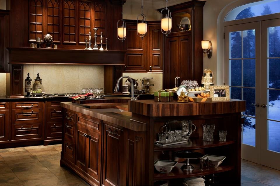 Design ideas for a mid-sized country u-shaped kitchen in Houston with dark wood cabinets, beige splashback, ceramic splashback, stainless steel appliances, ceramic floors and with island.