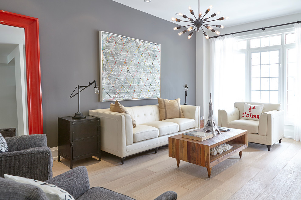 Inspiration for a mid-sized transitional formal and enclosed light wood floor living room remodel in Toronto with gray walls, no tv and no fireplace