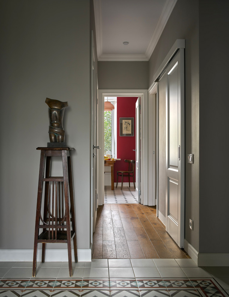 Design ideas for a small eclectic entry hall in Yekaterinburg with grey walls, porcelain floors, a single front door, a dark wood front door, multi-coloured floor, recessed and wallpaper.