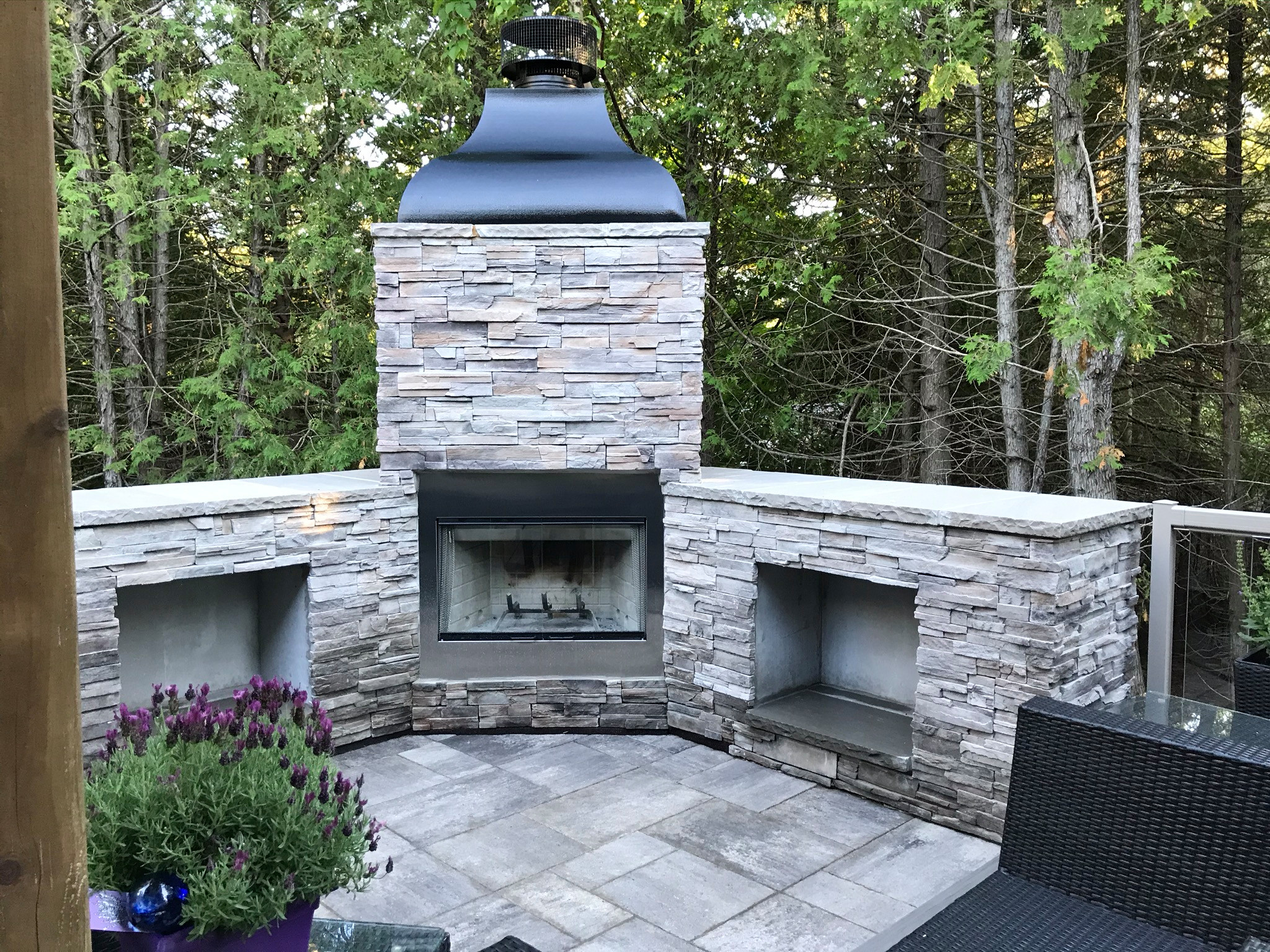 This composite deck provides a maintenance free outdoor living space complete with a fireplace and dining area. This deck doubles as a front entrance, that is if you don't get caught up enjoying the w