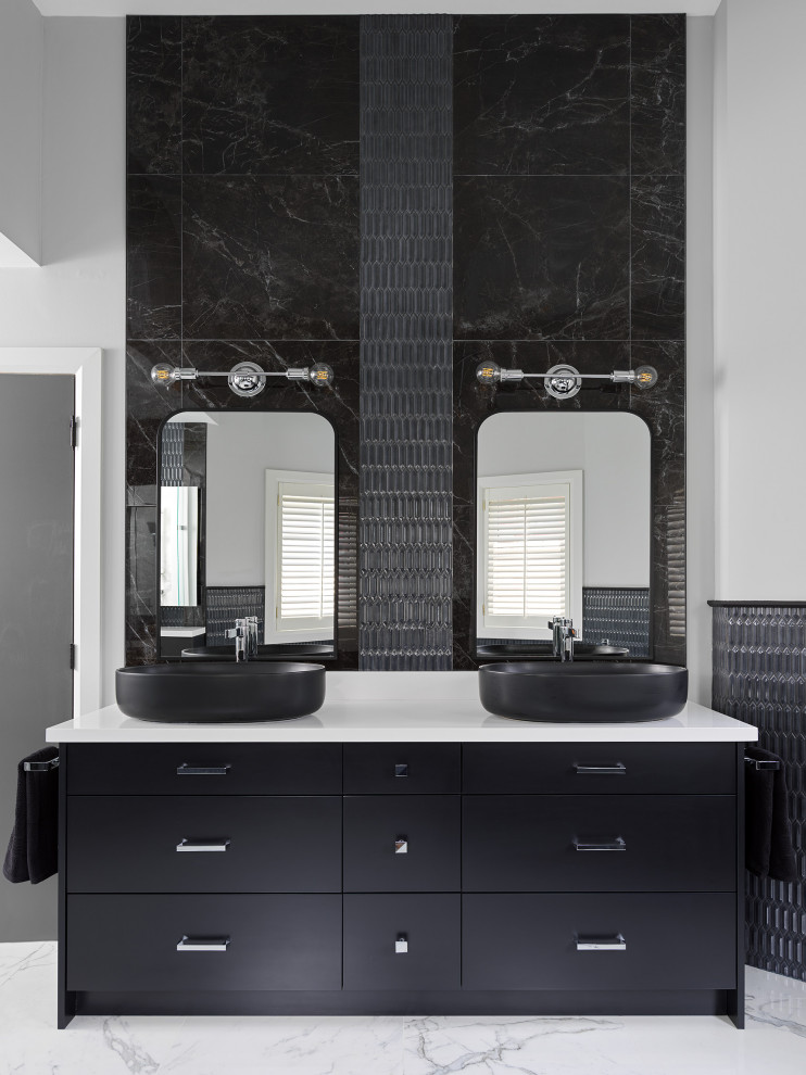 Photo of a large contemporary master bathroom in Toronto with flat-panel cabinets, black cabinets, a freestanding tub, a corner shower, a one-piece toilet, black tile, ceramic tile, grey walls, marble floors, a vessel sink, engineered quartz benchtops, white floor, a hinged shower door, white benchtops, a niche, a double vanity and a built-in vanity.