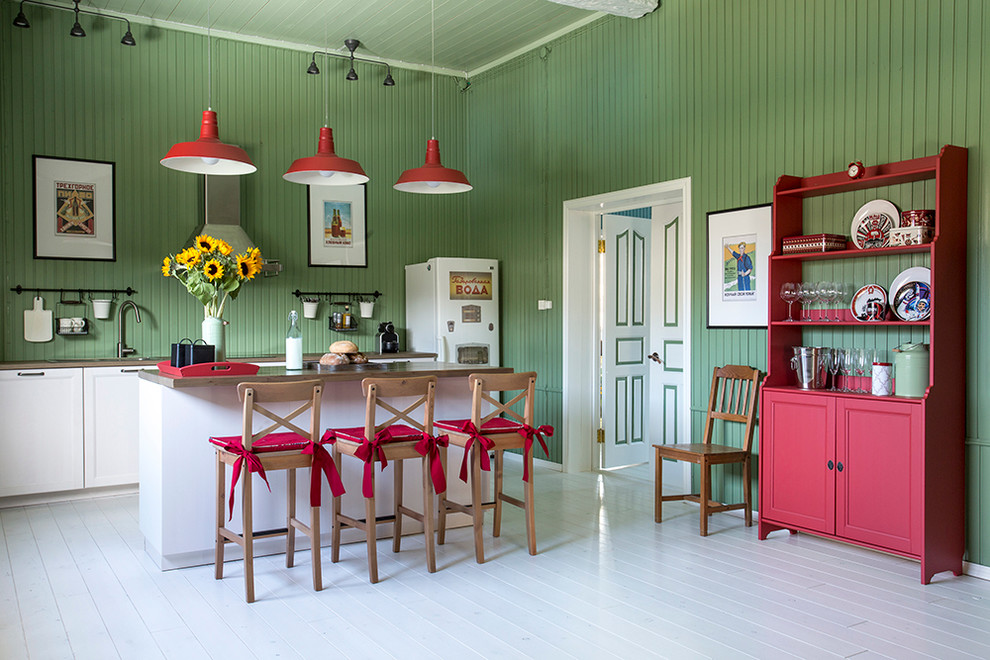 Inspiration for a country single-wall eat-in kitchen in Moscow with with island, recessed-panel cabinets, white cabinets, green splashback and painted wood floors.