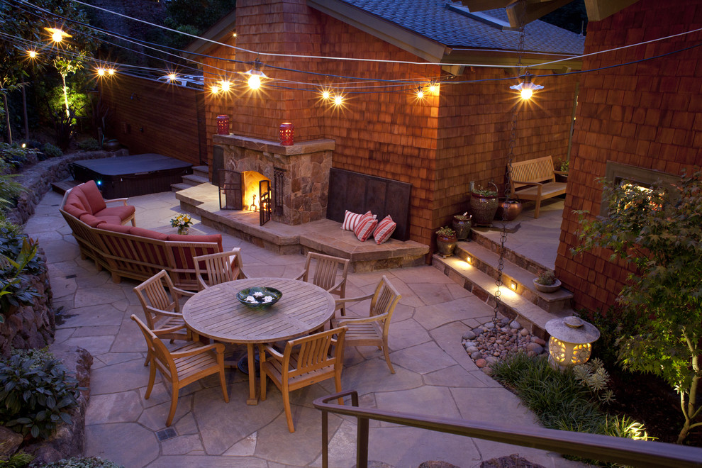 Traditional patio in San Francisco with natural stone pavers and a fire feature.