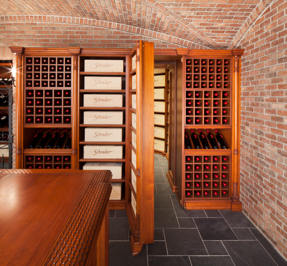 Inspiration for a huge victorian ceramic tile and gray floor wine cellar remodel in New York with display racks
