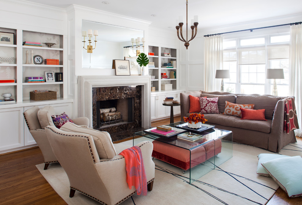 Photo of a transitional living room in Atlanta with a stone fireplace surround and white walls.