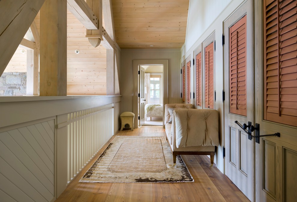 Design ideas for a beach style hallway in Toronto with white walls and medium hardwood floors.