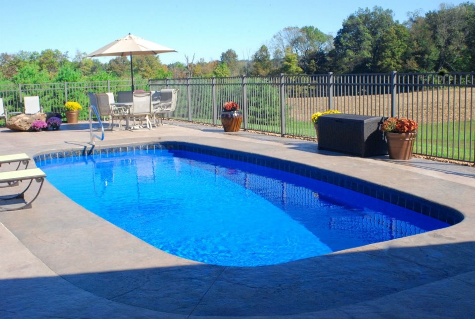 Example of a mid-sized backyard rectangular pool design in Indianapolis