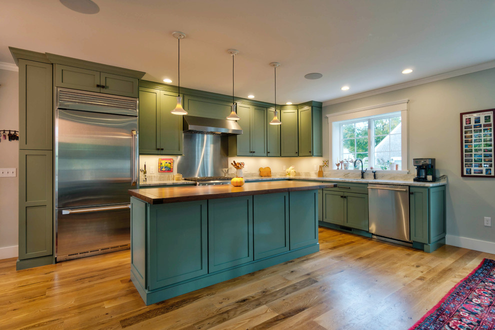Inspiration for a mid-sized eclectic l-shaped eat-in kitchen in Boston with an undermount sink, shaker cabinets, grey cabinets, wood benchtops, grey splashback, metal splashback, stainless steel appliances, light hardwood floors, with island and brown floor.