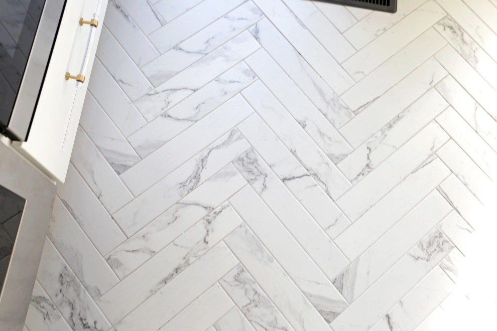 Mid-sized transitional l-shaped marble floor, white floor and exposed beam kitchen photo in DC Metro with an undermount sink, shaker cabinets, white cabinets, quartzite countertops, white backsplash, quartz backsplash and stainless steel appliances