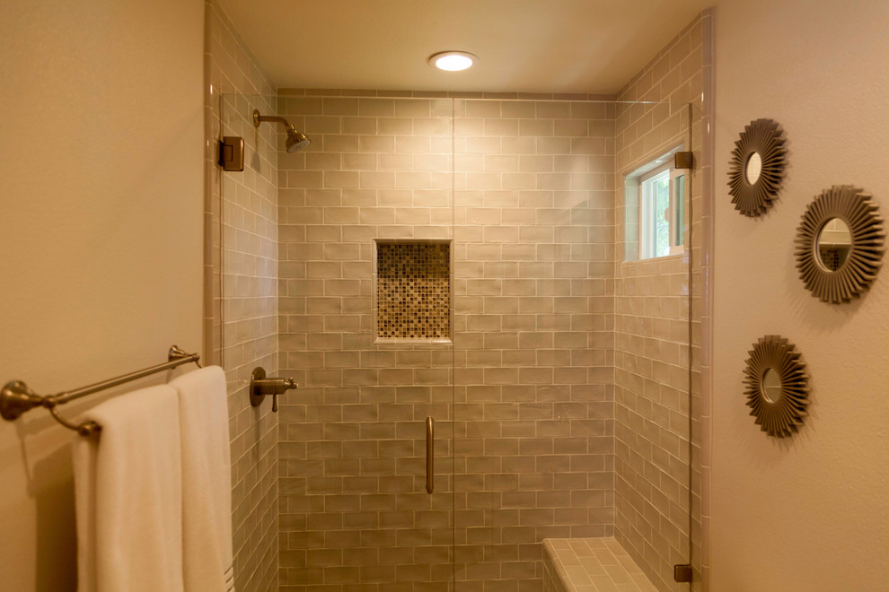 Design ideas for a mid-sized traditional master bathroom in Los Angeles with recessed-panel cabinets, white cabinets, an alcove shower, a one-piece toilet, beige tile, ceramic tile, white walls, porcelain floors and an undermount sink.