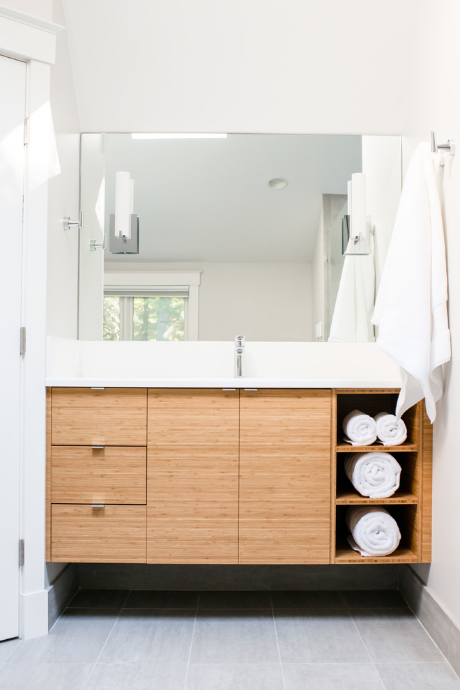Inspiration for a large transitional master bathroom in Portland Maine with flat-panel cabinets, light wood cabinets, an alcove shower, a two-piece toilet, white walls, ceramic floors, an undermount sink, a corner tub and white tile.