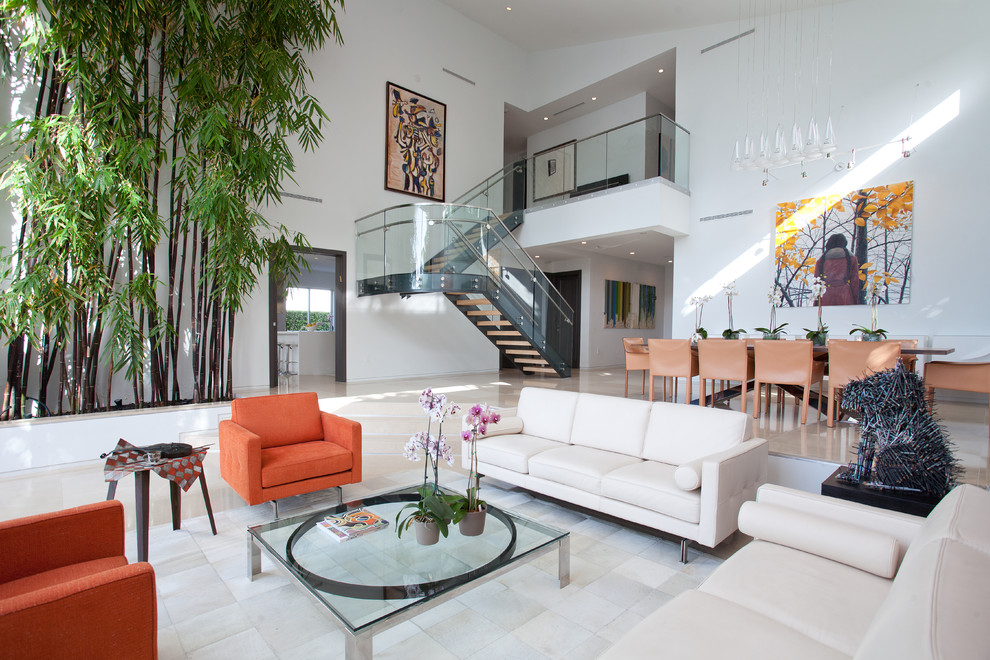 Photo of a large contemporary formal open concept living room in Miami with white walls, no fireplace, no tv, marble floors and white floor.