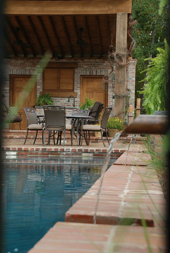 Inspiration for a transitional pool remodel in New Orleans