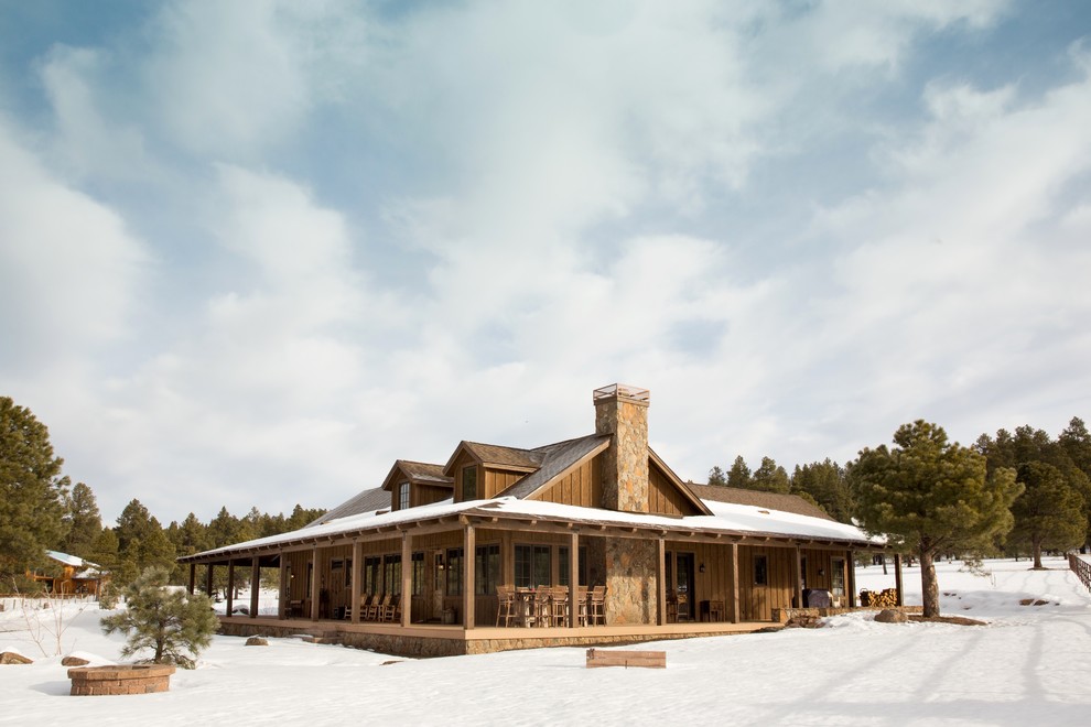 Example of a mid-sized mountain style brown one-story wood gable roof design in Phoenix with a shingle roof