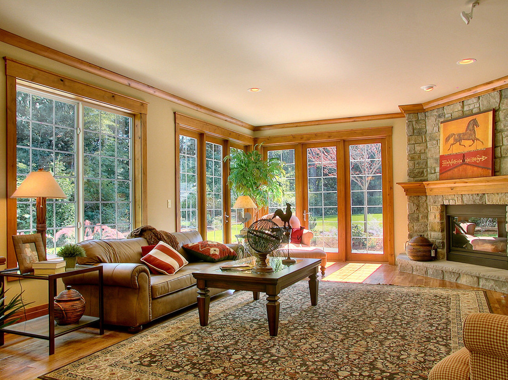 Design ideas for a country family room in Seattle with a corner fireplace.