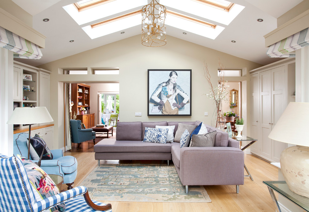 Inspiration for a transitional formal enclosed living room in Belfast with beige walls and light hardwood floors.