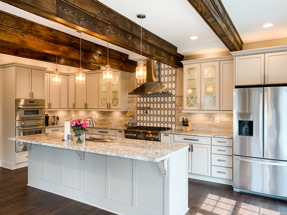 Example of a transitional kitchen design with flat-panel cabinets, gray cabinets, granite countertops, gray backsplash, porcelain backsplash and an island