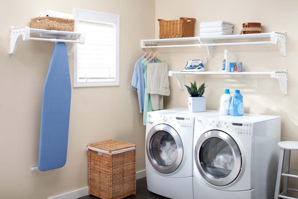 Dedicated laundry room - mid-sized transitional l-shaped dark wood floor dedicated laundry room idea in Miami with beige walls, a side-by-side washer/dryer and open cabinets