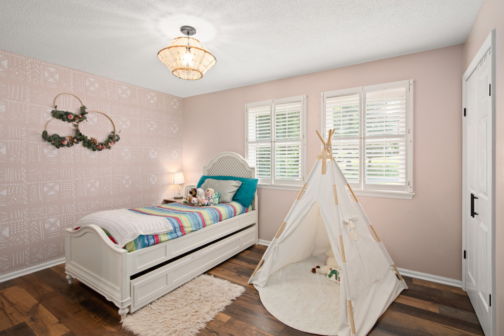 Kids' bedroom - bedroom and mid-sized transitional girl dark wood floor and brown floor kids' bedroom idea with pink walls
