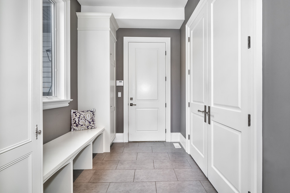 Example of a large transitional porcelain tile and gray floor mudroom design in Toronto with gray walls