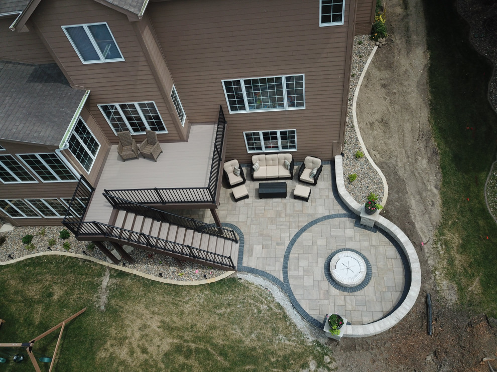 Mid-sized backyard second story metal railing deck photo with no cover