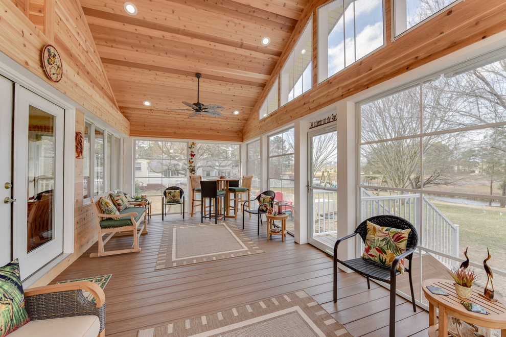 This is an example of a mid-sized arts and crafts sunroom in Other with dark hardwood floors, no fireplace, a standard ceiling and brown floor.
