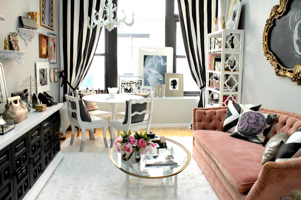 Inspiration for a small eclectic enclosed living room in Kansas City with grey walls and light hardwood floors.