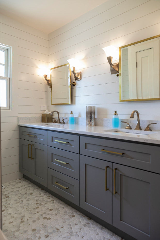 Photo of a mid-sized transitional master bathroom in Chicago with grey cabinets, a bidet, white tile, white walls, multi-coloured floor, white benchtops, a double vanity, shaker cabinets, an alcove tub, a shower/bathtub combo, porcelain tile, porcelain floors, a drop-in sink, engineered quartz benchtops, a built-in vanity, planked wall panelling and a shower curtain.