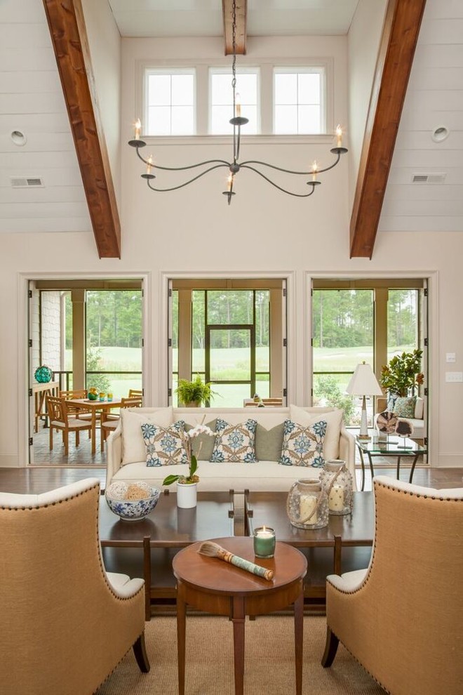 Design ideas for a large traditional open concept living room in Wilmington with beige walls and medium hardwood floors.