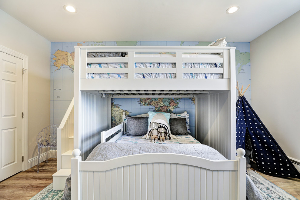 Design ideas for a mid-sized transitional kids' bedroom for kids 4-10 years old and boys in New York with grey walls, medium hardwood floors and beige floor.