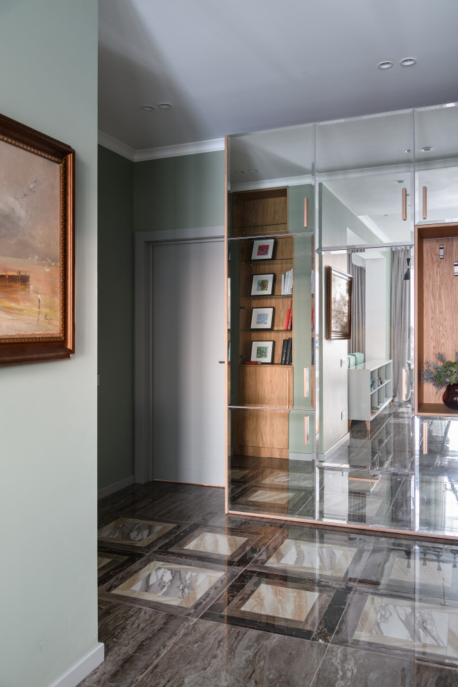 This is an example of a medium sized contemporary entrance in Novosibirsk with grey walls, porcelain flooring, a single front door, a grey front door and brown floors.