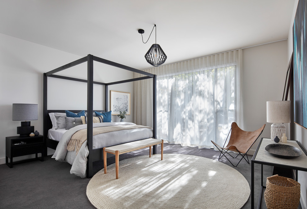 Contemporary bedroom in Melbourne with white walls, carpet and grey floor.