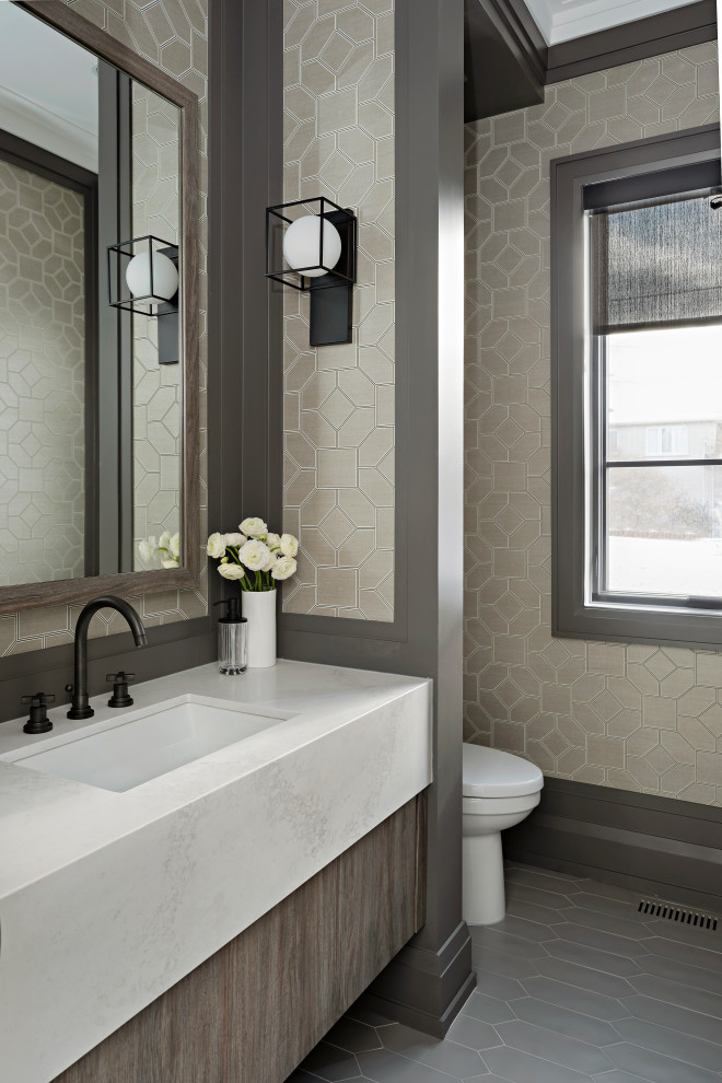 This is an example of a transitional powder room in Toronto.