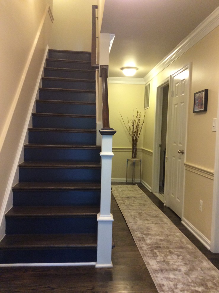 Foyer - mid-sized transitional dark wood floor and brown floor foyer idea in DC Metro with yellow walls