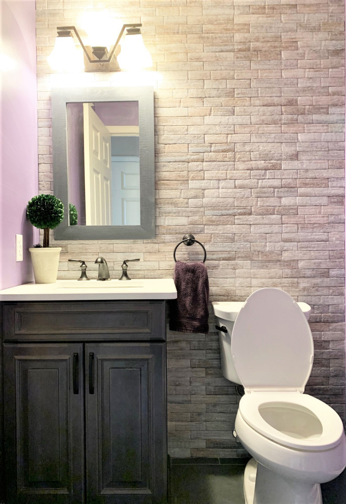 This is an example of a small farmhouse cloakroom in Detroit with shaker cabinets, dark wood cabinets, multi-coloured tiles, porcelain tiles, purple walls, porcelain flooring, a submerged sink, engineered stone worktops, grey floors, grey worktops, a built in vanity unit and a one-piece toilet.