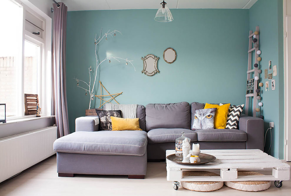 Photo of a contemporary enclosed living room in Amsterdam with blue walls.