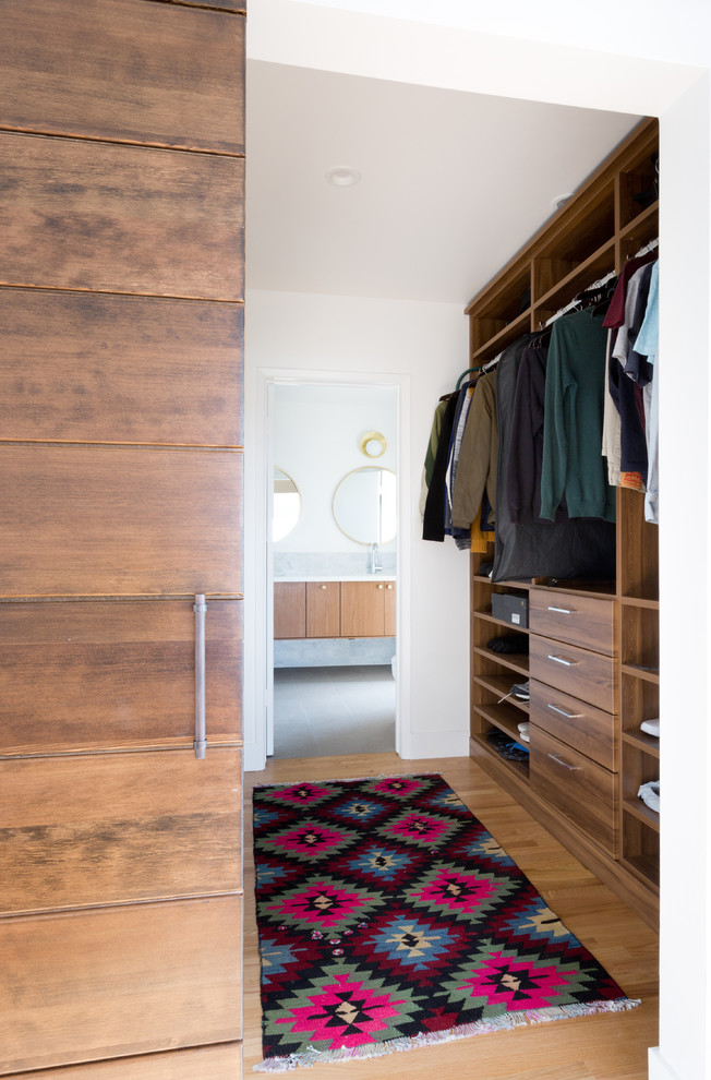 Contemporary storage and wardrobe in Los Angeles with beige floor.