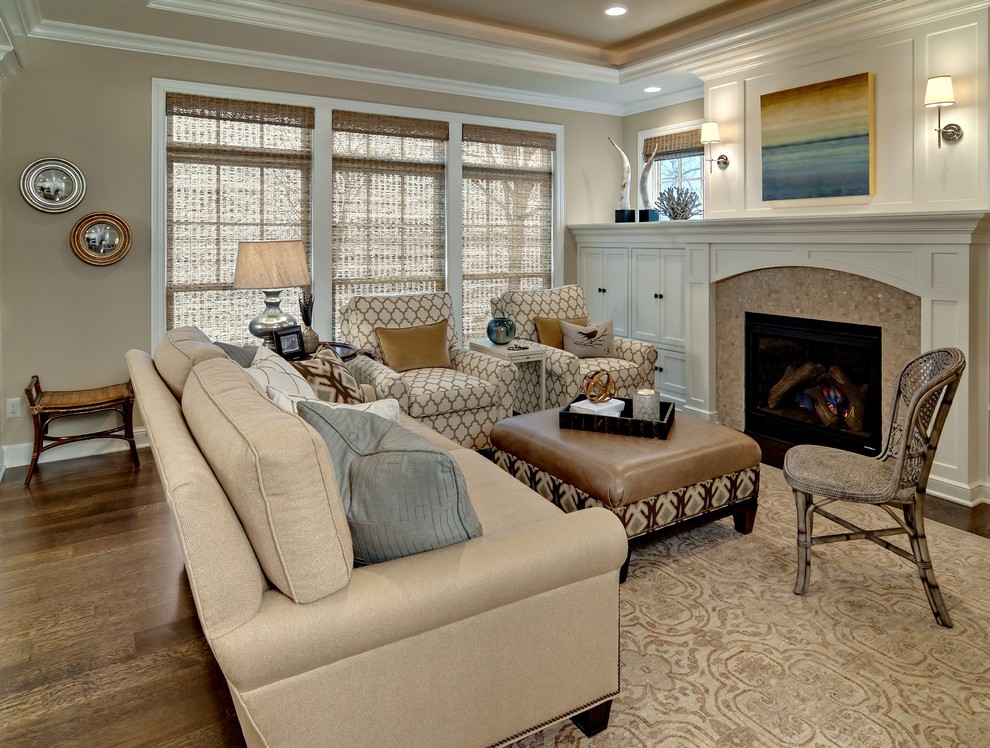 Mid-sized traditional formal enclosed living room in Minneapolis with beige walls, a standard fireplace, no tv, dark hardwood floors and a wood fireplace surround.